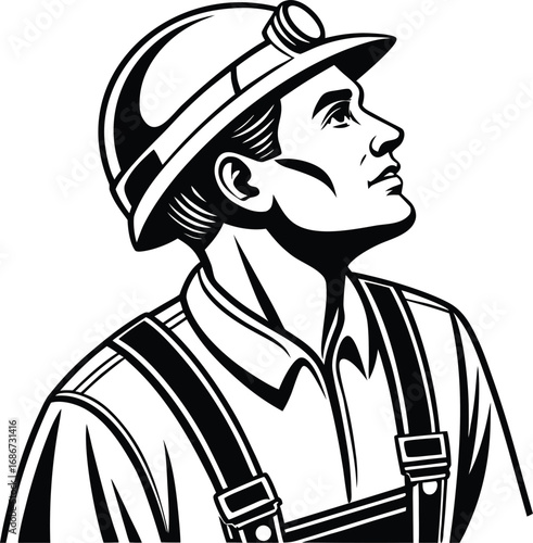 Miner wearing hard hat and overalls looking up with determination