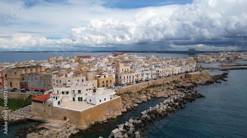 Gallipoli - Italy, Apulia - spectacular parallel circling aerial photograph of the western shore road around Bastione San Domenico