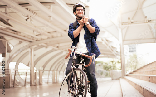 Smart businessman ride bicycle in downtown. Environmentalist commuting by cycling reduce carbon footprint global warming. Bike to work eco friendly alternative transportation green energy vehicle