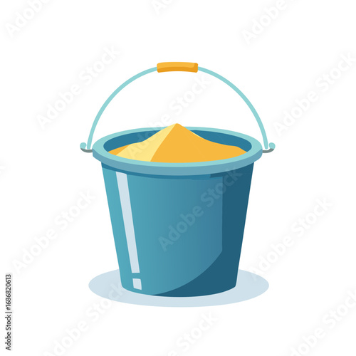 Blue sand bucket filled with yellow sand for summer beach fun and children's play activity