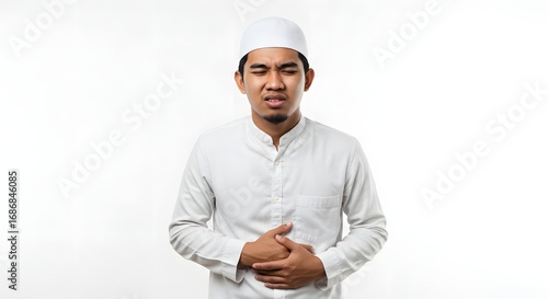 Young Muslim Man Experiencing Stomach Pain