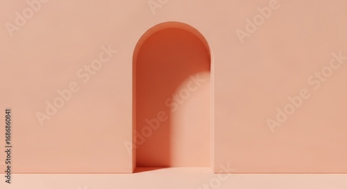 Minimalist peach wall with arched doorway casting soft shadows in a simple room