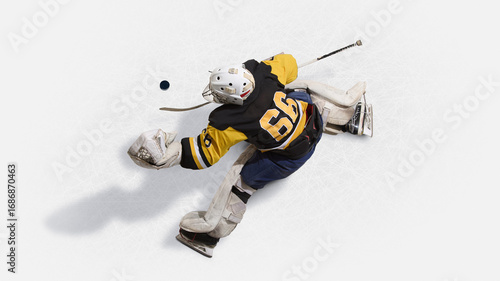 Bild auf Leinwand Overhead view hockey goalkeeper in yellow jersey leaping to block puck
