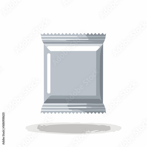 A single blank silver foil wrapper for a small snack or candy with a serrated edge and a slight shadow below