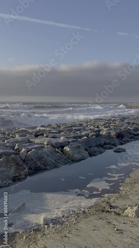 Beautiful waves on the Portuguese coast. Ocean landscape. Big waves against a beautiful sky.