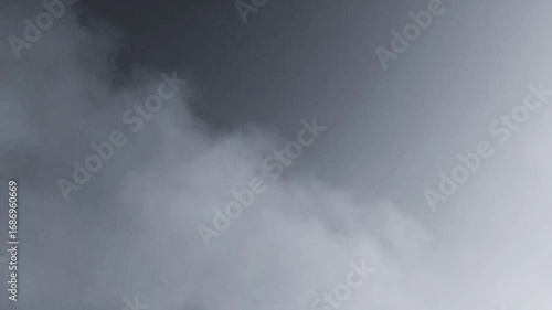 Realistic atmospheric smoke moving up. White fog or steam in slow motion. Fire smoke, vapor, misty fog. Soft smoke slowly moving. Ideal for add into your shot