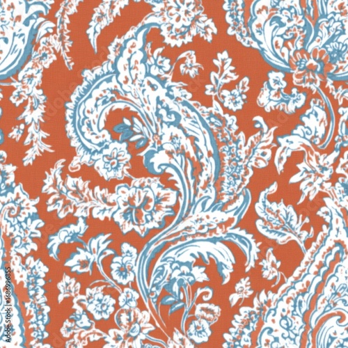 A patterned orange and white fabric with flowers and leaves. The flowers are in various sizes and are scattered throughout the design. Scene is one of elegance and sophistication