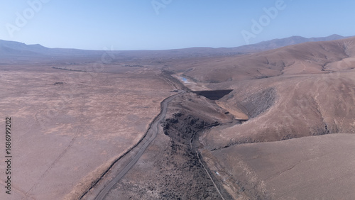 Aerial View of Desert Reservoir and Dam Structure in Arid Mountainous Landscape