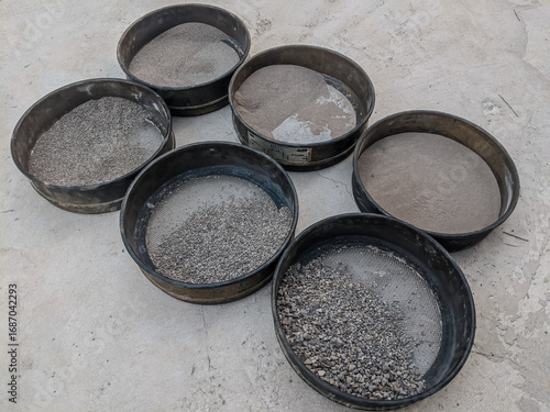 Cuadro en lienzo Laboratory sand sieve analysis showing different grain sizes separated in metal