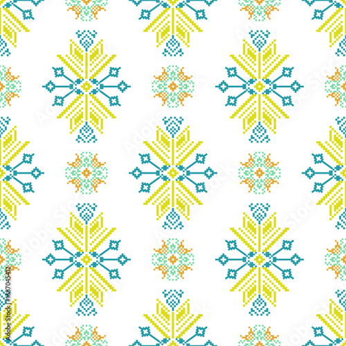 Cross-stitch seamless pattern with yellow and blue snowflakes. Scandinavian style. Vector illustration. Pixel design pattern for wallpaper, wrapping, rugs, tiles, and textiles.