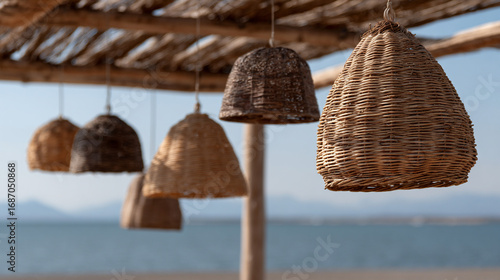 Wicker lamps of various shapes hanging.