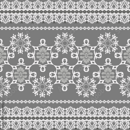 Damask seamless pattern with white lace on a gray background. Vector illustration. Ideas for elaborate borders, tiles, rugs, lace shirts, sarees, and textiles. 