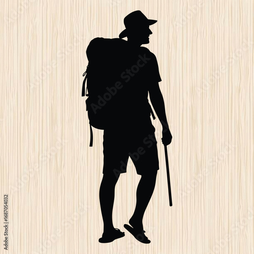 solo traveler standing on the beach wearing a large backpack 