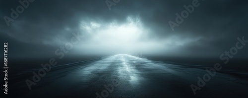 A serene, moody landscape featuring a dark road disappearing into mist and clouds, conveying a sense of mystery and exploration.