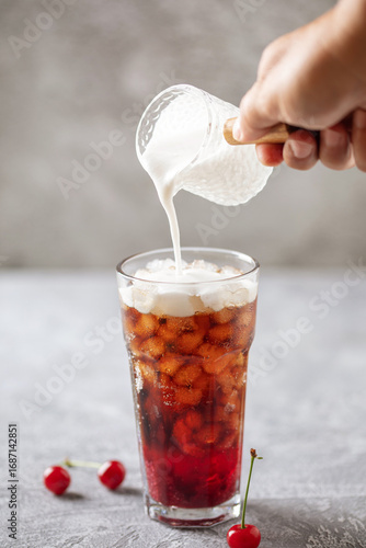 Cherry cola dirty soda in glass. Trending summer drink