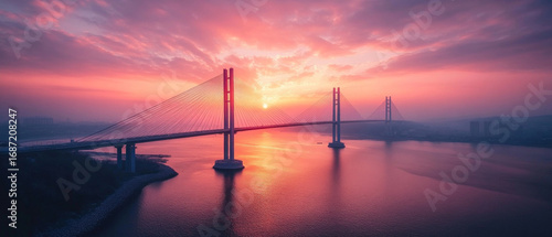 The bridge against the backdrop of the sunset over the water embodies the harmony between architecture and nature, ideal for tourist sites and travel articles.