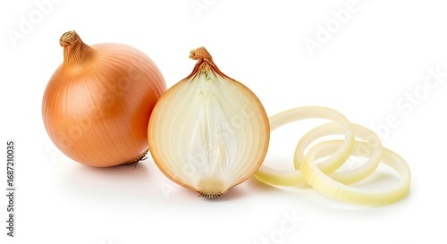Two whole unpeeled onions one sliced with rings beside on a white background