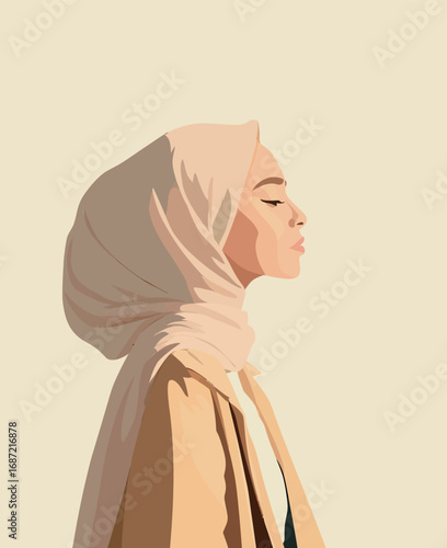 A woman is depicted in profile, wearing a light beige hijab and a tan coat. The soft background enhances her serene expression and elegant posture.