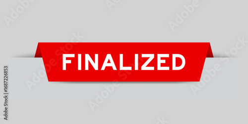 Red color inserted label with word finalized on gray background