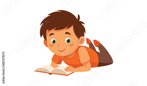 Young boy lying down reading a book with a happy expression