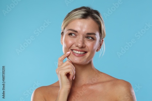 Wallpaper Mural Woman with beautiful healthy teeth on light blue background Torontodigital.ca