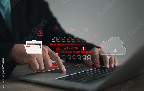 Cybersecurity concept showing businessman using laptop with warning alert icons, cloud data storage risks, and digital threats. Technology background for data protection, hacking, and IT security.