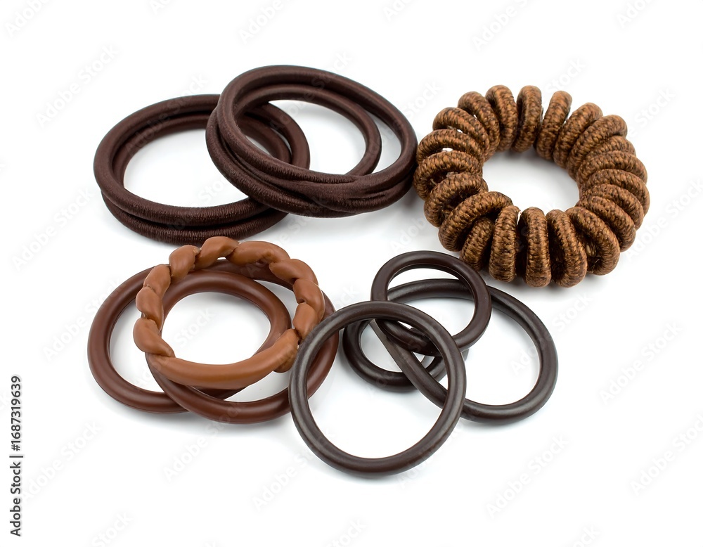 Fototapeta premium Assorted brown hair ties on white background (1)