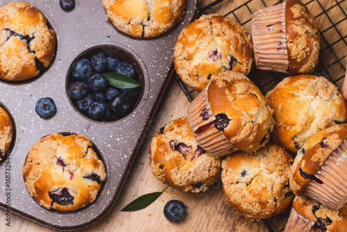 Blueberry muffins on a rustic table in a mold