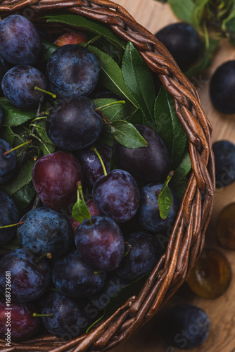 Ripe blue plums in a basket
