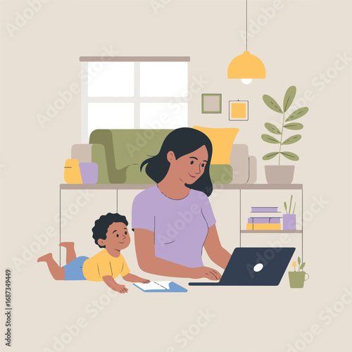 Busy mother working from home with baby lying on the floor