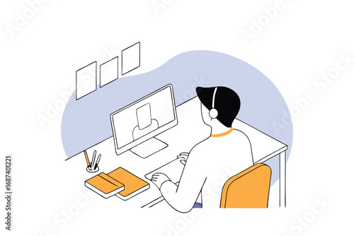 Person wearing headphones attending an online meeting on a computer desk
