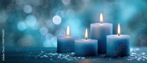 The tranquil blue candles radiating warmth and serenity in a beautiful setting.