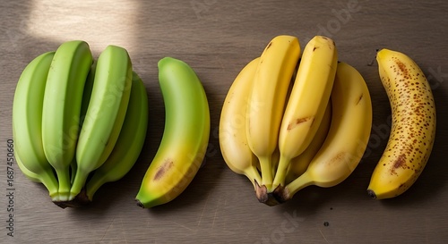 Stages of banana ripening green to yellow and brown fruit on textured surface