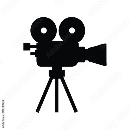 Black silhouette of a vintage movie camera on a tripod