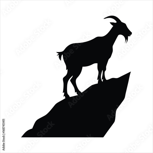 Black silhouette of a goat standing on a rocky outcrop