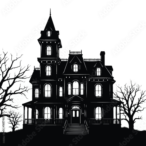 Silhouette of a large haunted victorian mansion at night