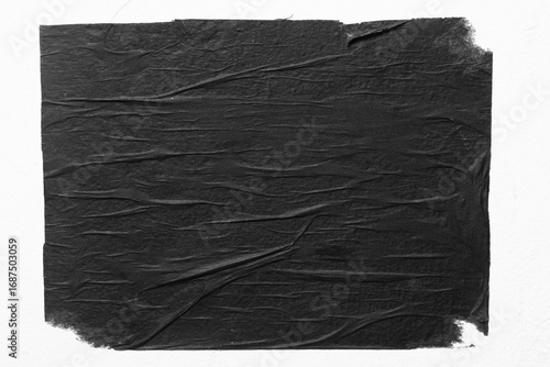 Black blank poster with folds close up.