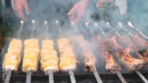 Grilling Skewers Enjoying Juicy Meat and Veggies in a Smoky BBQ Scene at Summer Gatherings
