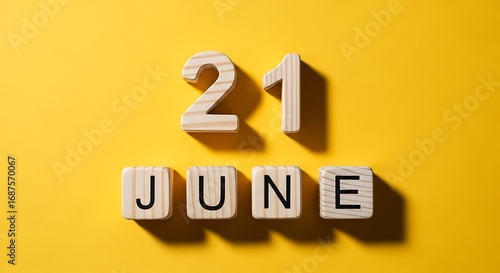 Twenty First June Date Wooden Blocks Yellow Background.