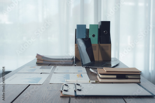 Business Documents and Laptop on Desk