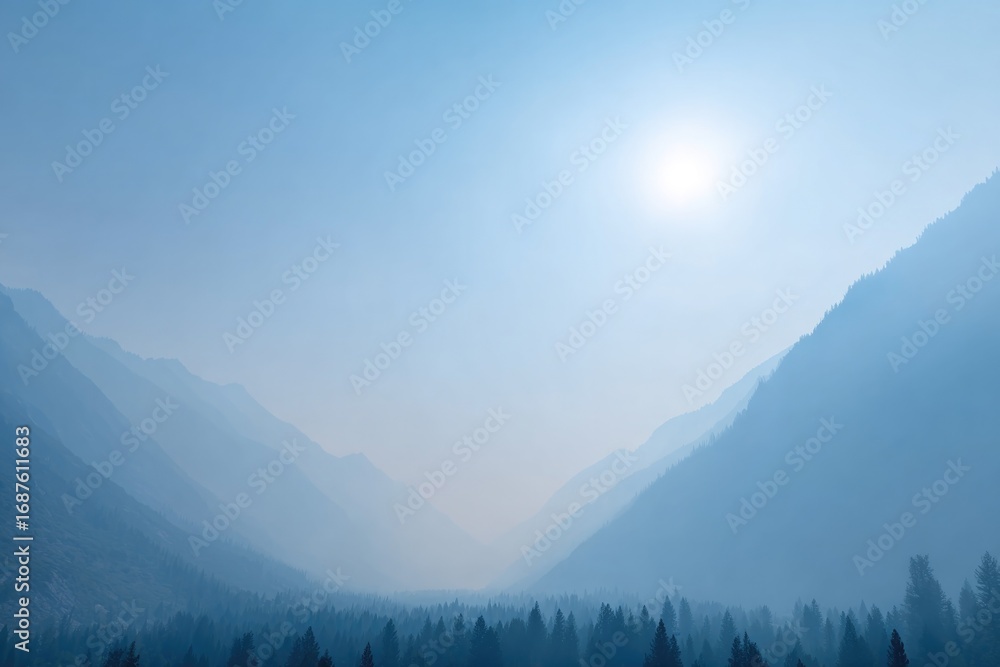 Obraz premium Misty mountains create serene landscape with soft blue hues and