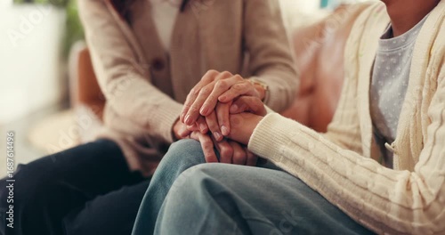 Women, holding hands and empathy in home for trust, compassion and friends with grief and helping. House, care and patience for person in living room, consoling or understanding of trauma or kindness