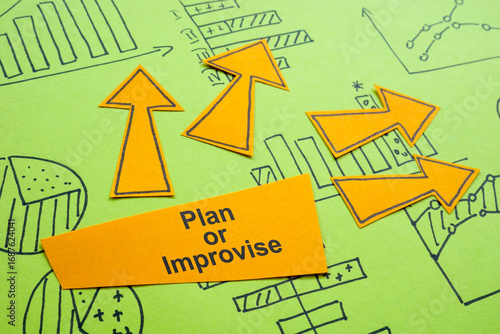 Canvas Print Charts with the words plan or improvise symbolizes business strategy
