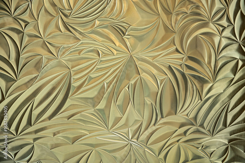 Golden metal background with modern grooves.
Gold colored pattern for a great wallpaper.