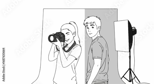 Photographer at work, capturing model in photo studio with backdrop and softbox. Photographer in action is fully engaged to take perfect photo of his handsome male model in photo studio.