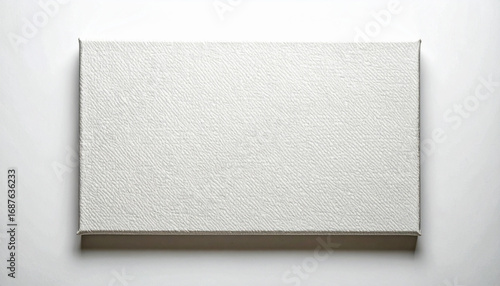 Blank canvas awaiting artistic creation on white surface