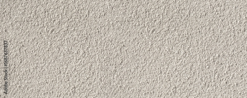 White rough plaster wall texture providing seamless background
