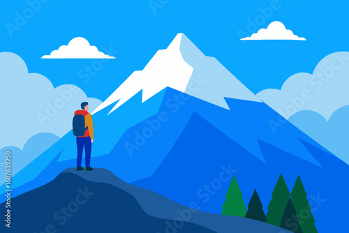 Hiker gazes at snow capped mountain peaks under blue sky