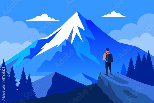 Hiker gazes at snow capped mountain peaks under blue sky