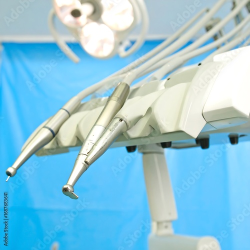 Dental tools close-up against a light blue backdrop